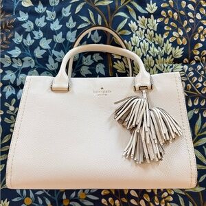 kate spade Pebbled Leather Satchel with Tassel Charm “Parchment” Color